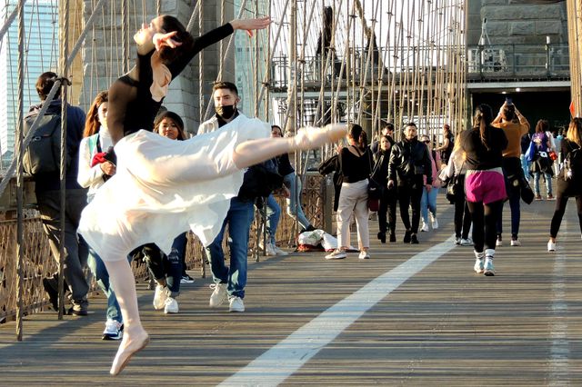 A photo of a dancer on the Brooklyn Bridge